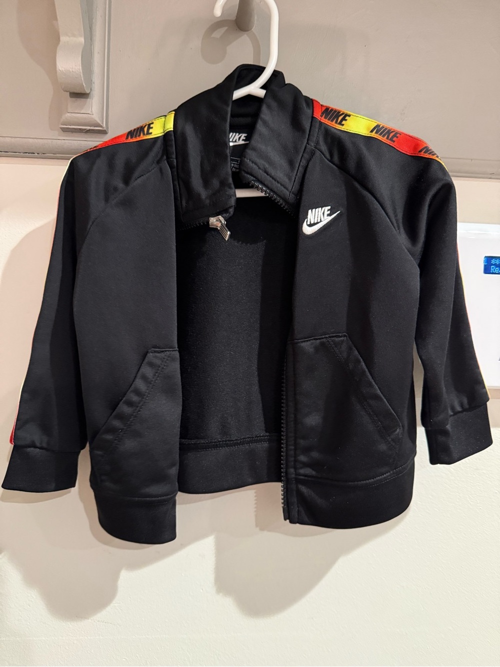 Nike Black Kids Track Jacket with Red & Yellow Shoulder Tape